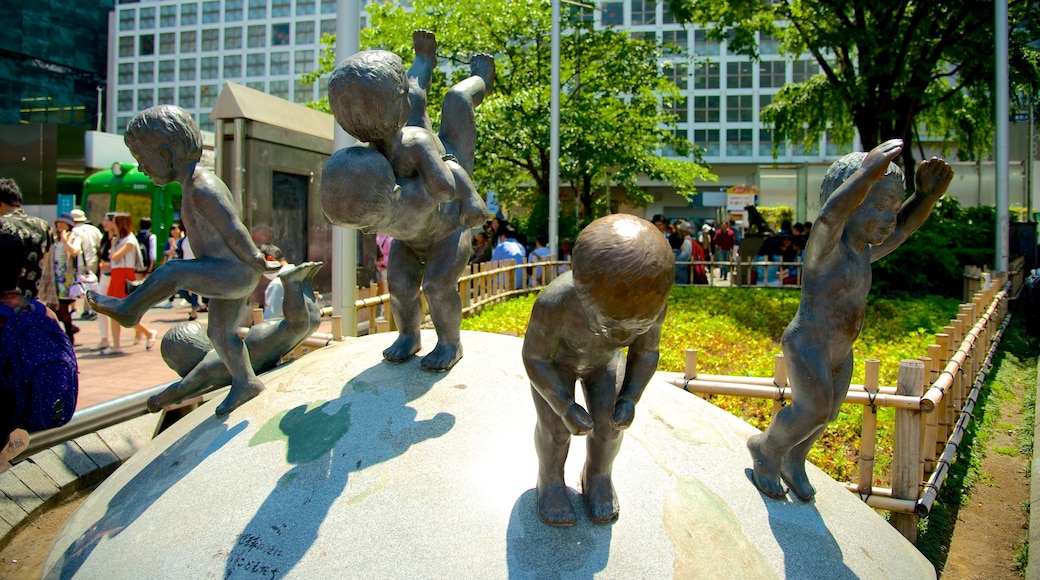 Shibuya showing a garden, a city and art