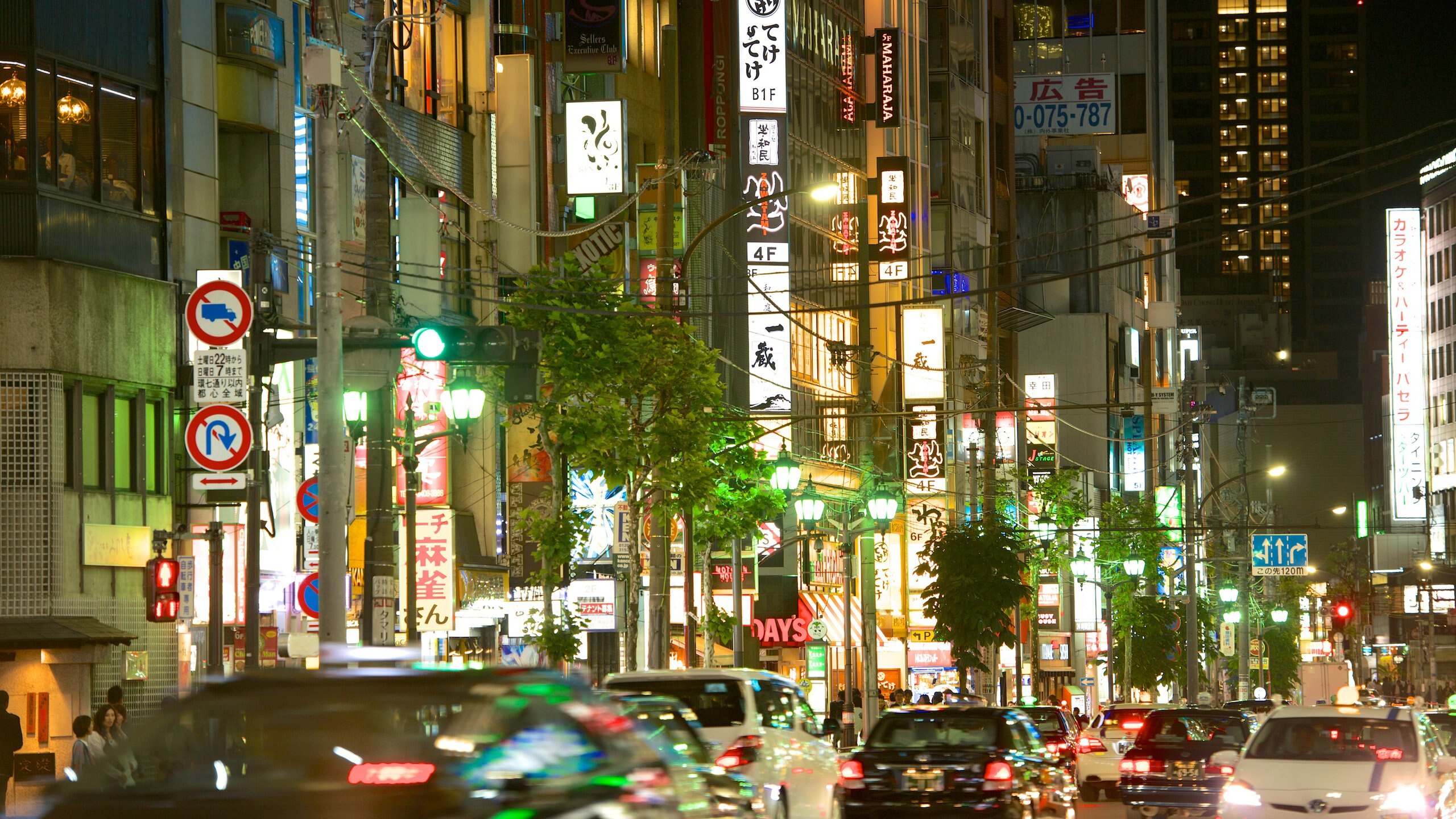 Roppongi which includes night scenes, a city and signage