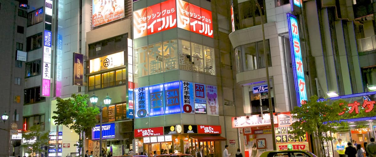 Roppongi showing night scenes, a city and shopping