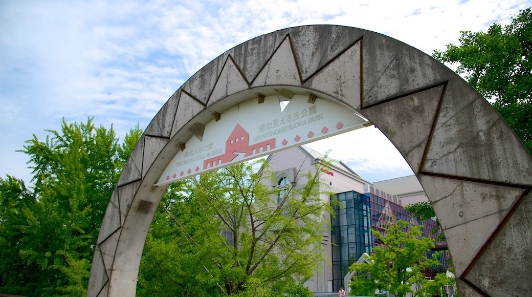 Yamashita Park showing signage and a city