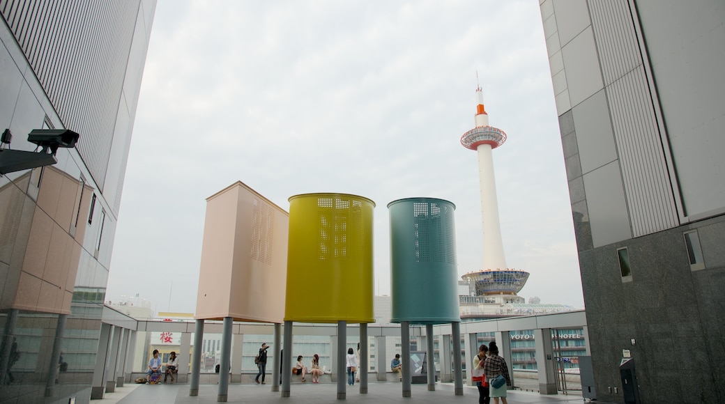 Kyoto Tower featuring a skyscraper, modern architecture and a city