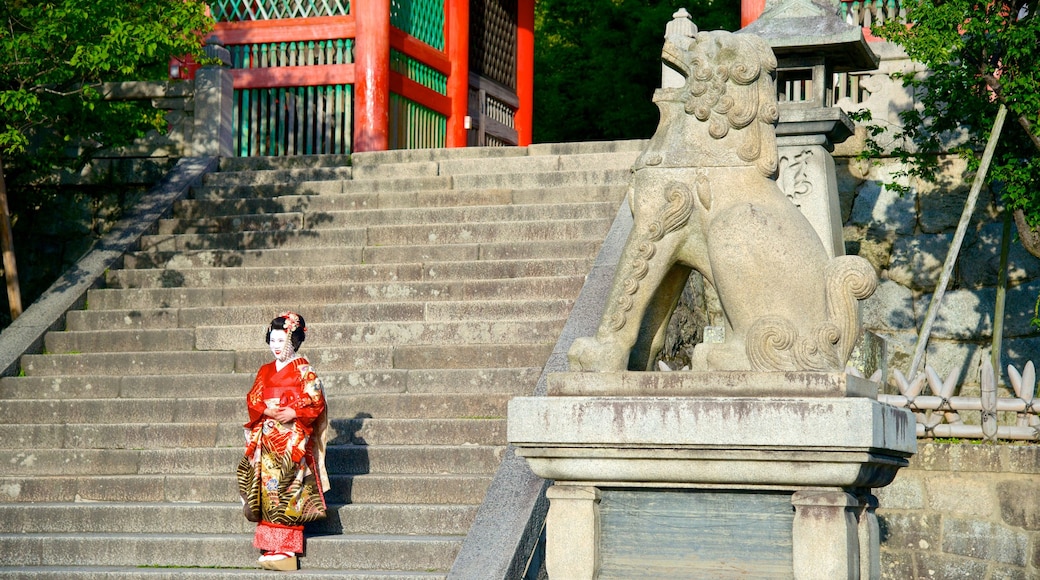 Kiyomizu Temple showing a temple or place of worship, a city and religious aspects