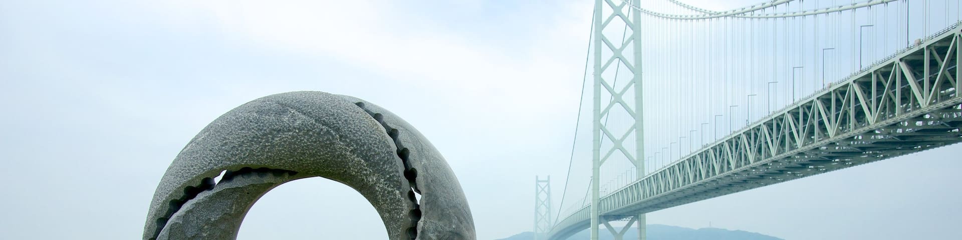 Akashi Kaikyo Bridge featuring a suspension bridge or treetop walkway, general coastal views and outdoor art