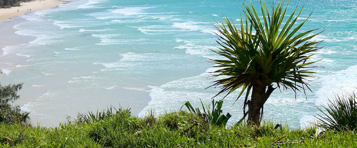 Fingal Lighthouse which includes landscape views, a beach and a coastal town