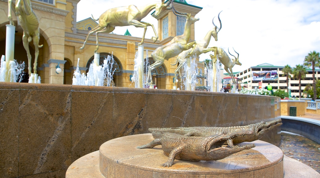 Gold Reef City featuring outdoor art, a fountain and art