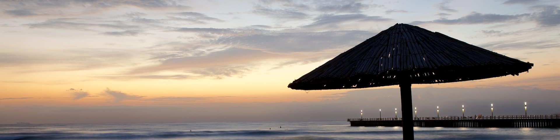 North Beach featuring a sunset and a beach