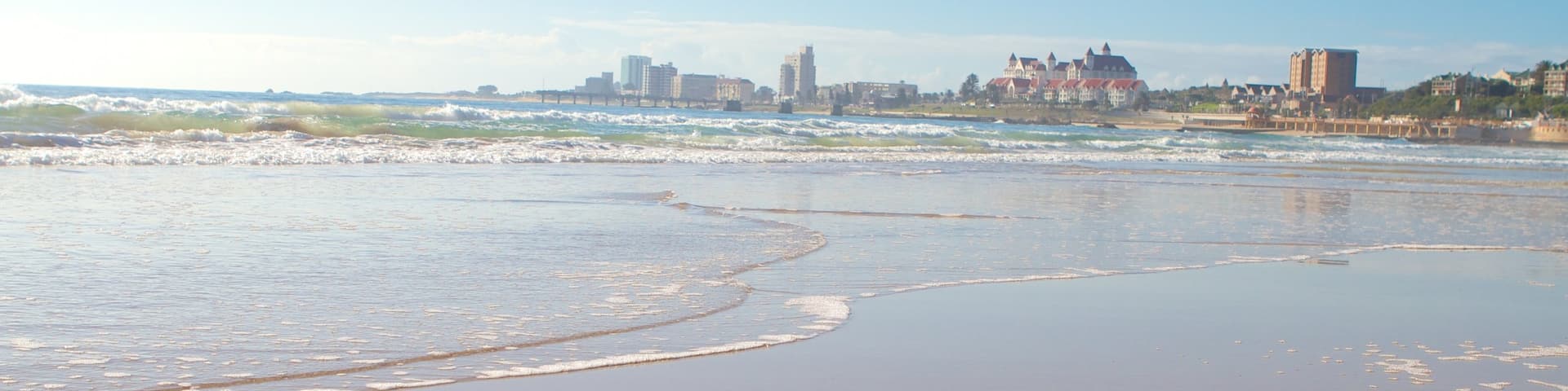 King\'s Beach which includes a coastal town and a beach