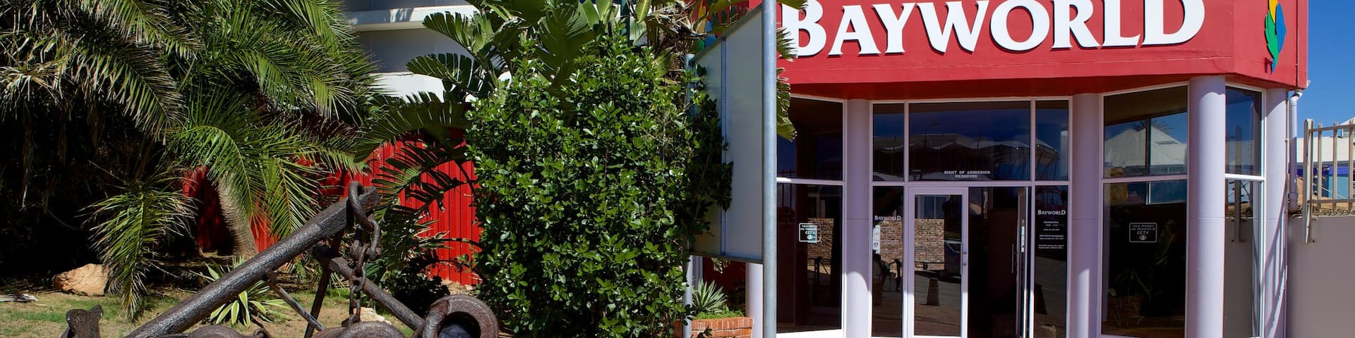 Bayworld showing signage, a city and outdoor art