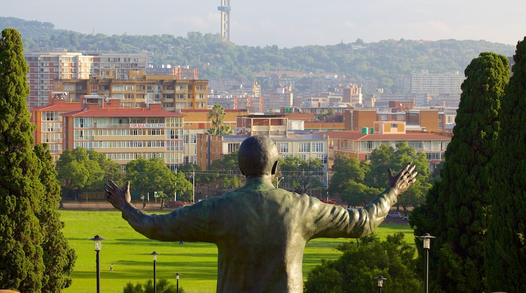 Union Buildings which includes a city, a statue or sculpture and art