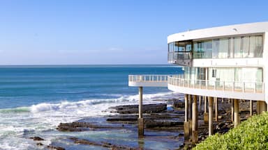 Eastern Beach which includes modern architecture, a house and general coastal views