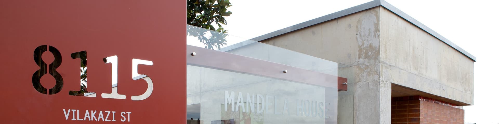Mandela House which includes signage and a city