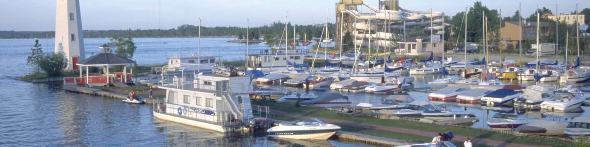 Red Deer featuring a bay or harbor, a lighthouse and boating