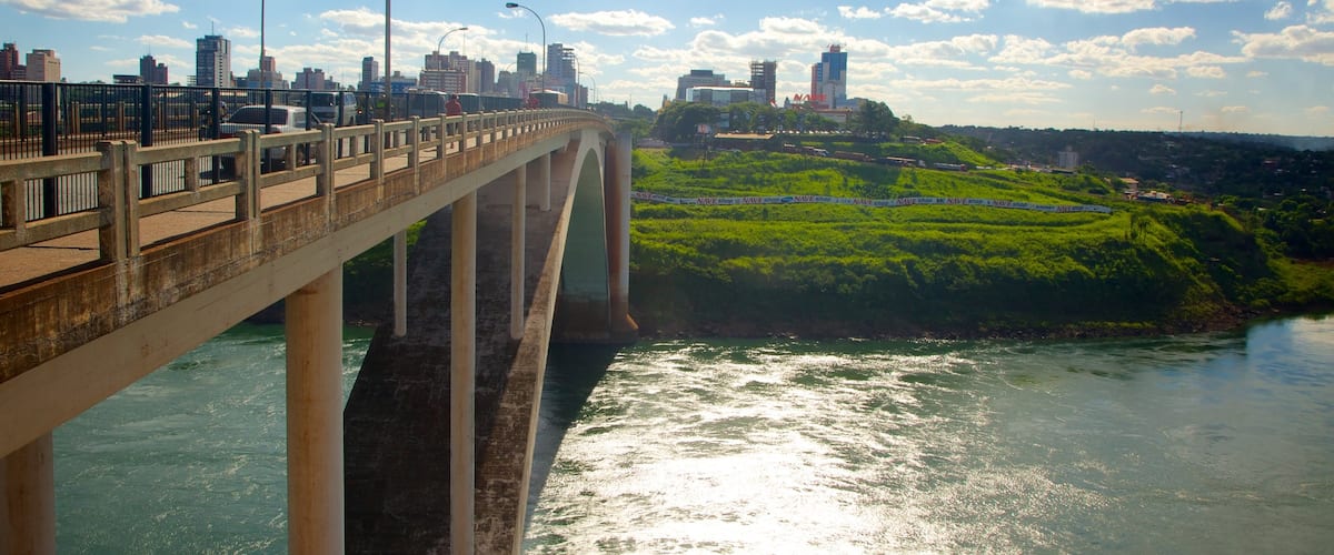 Friendship Bridge featuring landscape views, a river or creek and a city