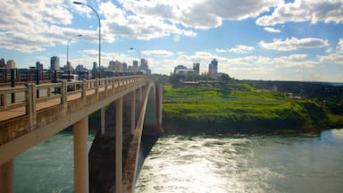 Friendship Bridge which includes a bridge, landscape views and a river or creek