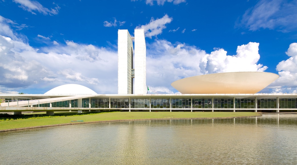 National Congress of Brazil which includes a pond, a city and modern architecture