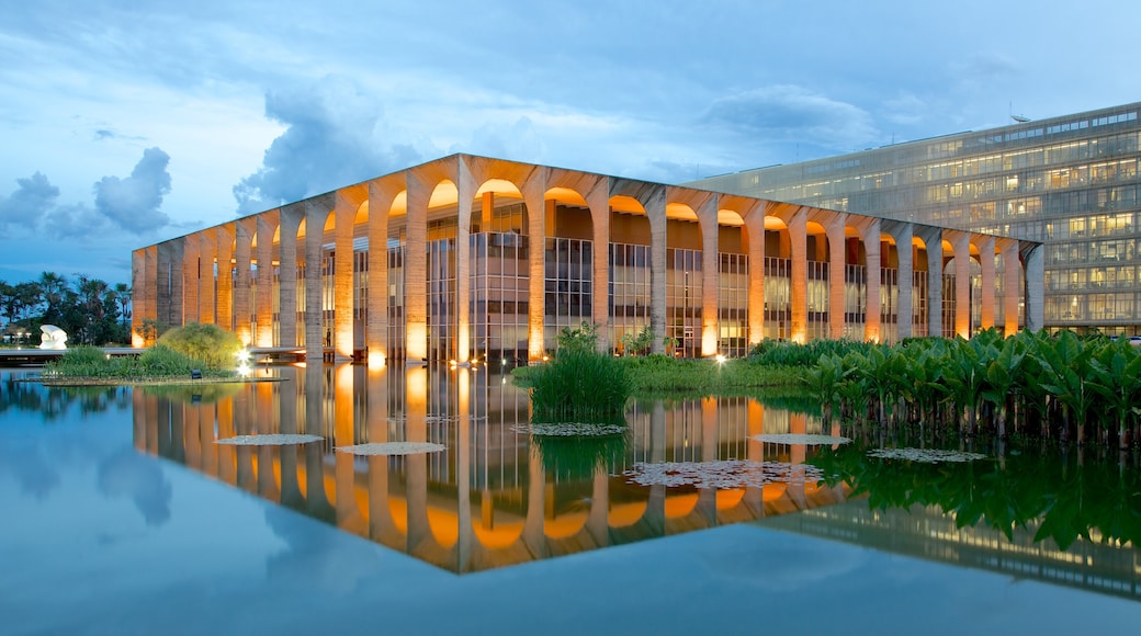 Itamaraty Palace which includes modern architecture, a lake or waterhole and a pond