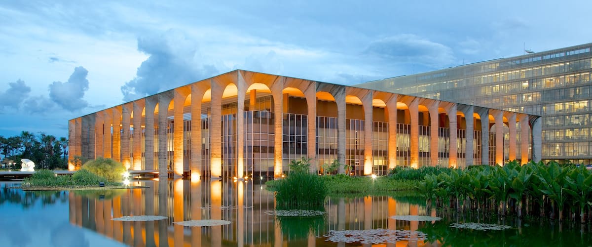 Itamaraty Palace which includes modern architecture, a lake or waterhole and a pond