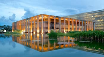 Itamaraty Palace which includes modern architecture, a lake or waterhole and a pond