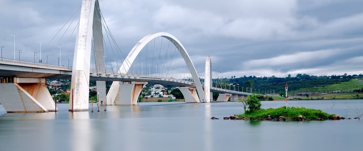 Juscelino Kubitschek Bridge featuring a lake or waterhole, modern architecture and a river or creek