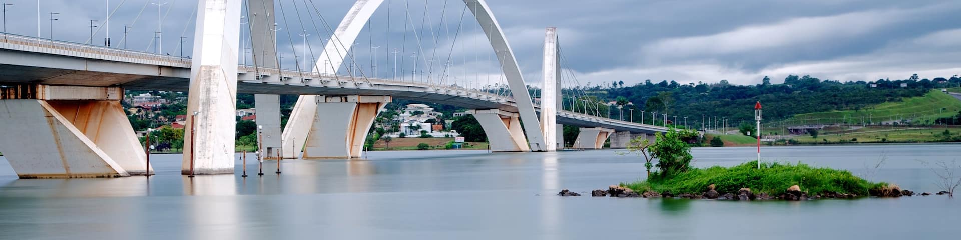 Juscelino Kubitschek Bridge featuring a lake or waterhole, modern architecture and a river or creek