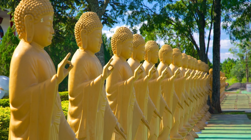 Buddhist Temple which includes a temple or place of worship and religious elements