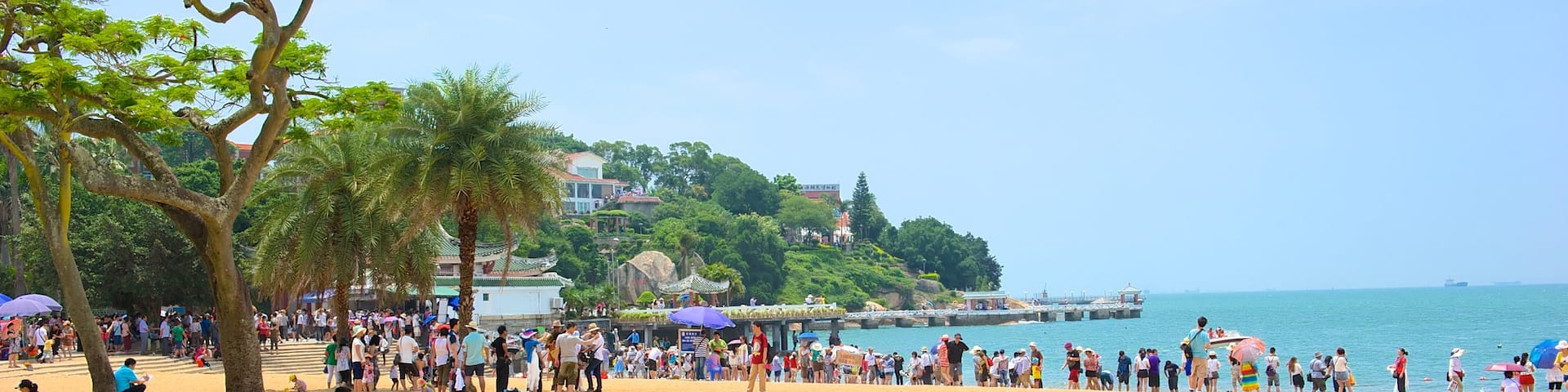 Gulangyu Island which includes landscape views, a sandy beach and tropical scenes