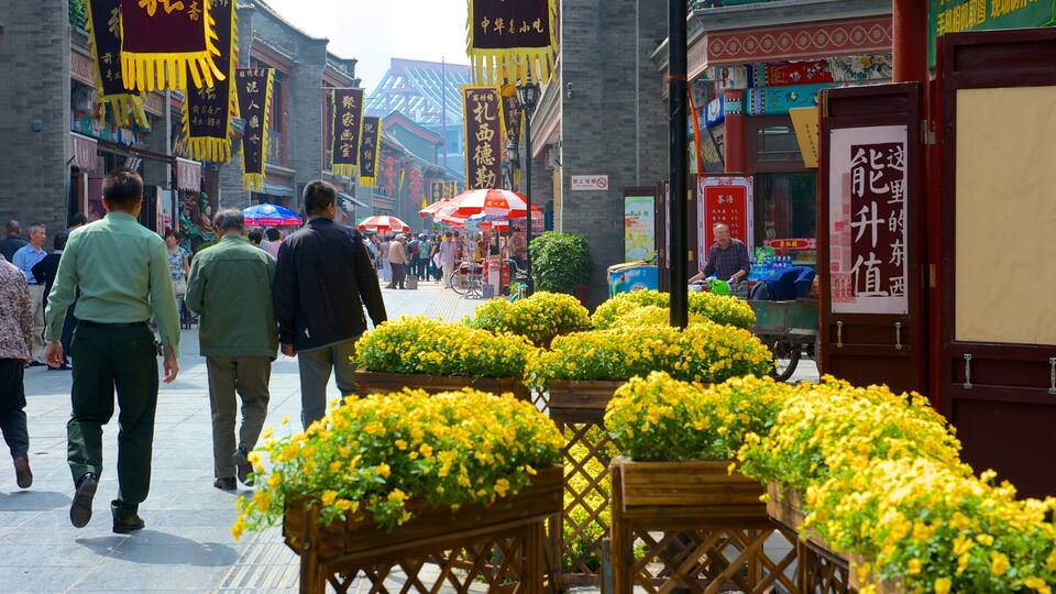 Ancient Culture Street som omfatter en by, blomster og markeder