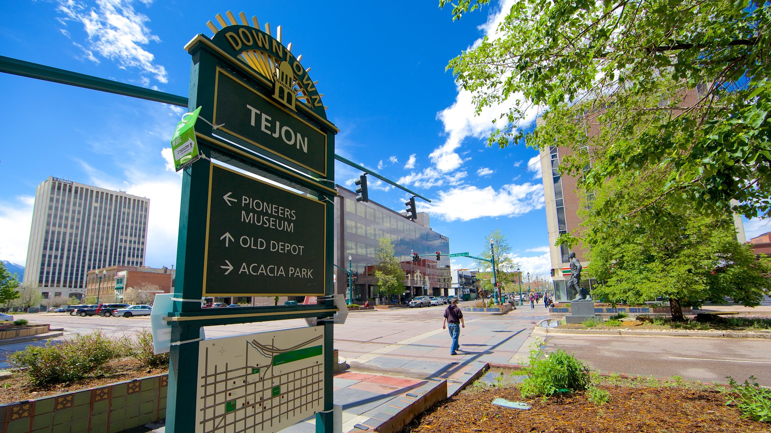 Downtown Colorado Springs showing a city, street scenes and signage