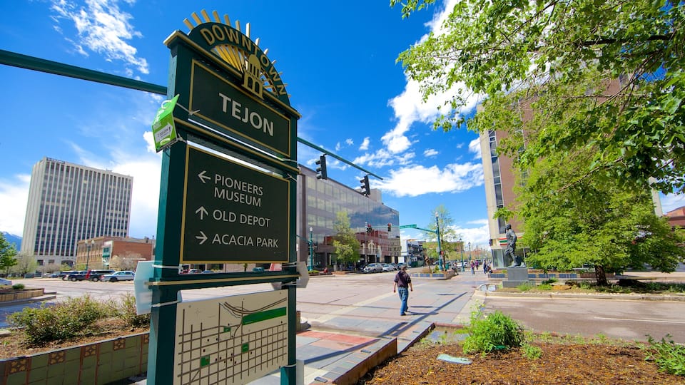 Downtown Colorado Springs featuring a city, signage and street scenes