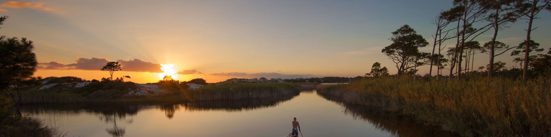 Grayton Beach State Park showing water sports and a sunset
