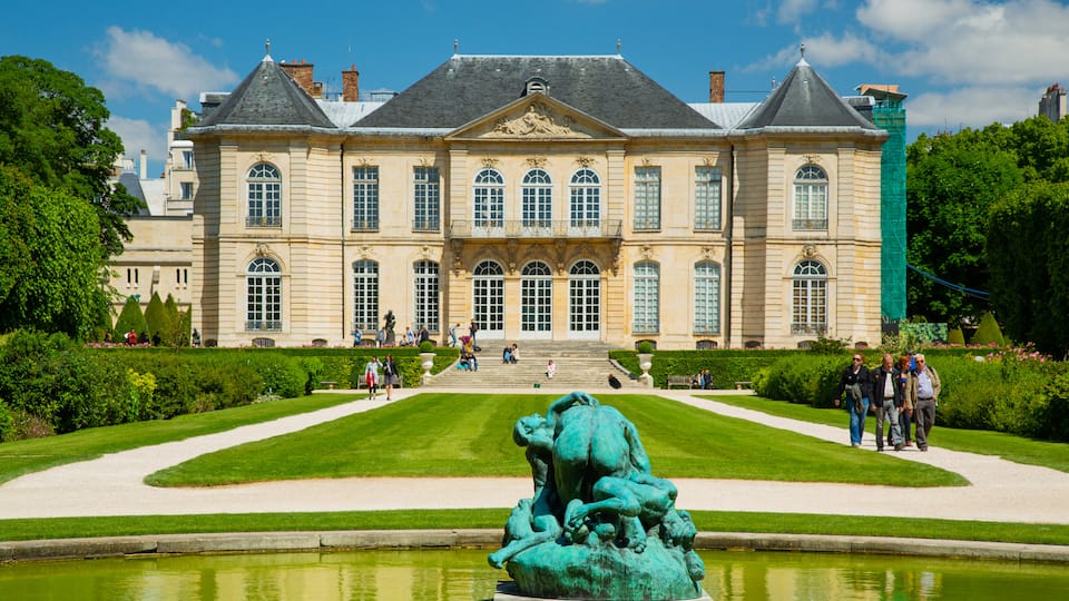 Paris featuring a pond, heritage architecture and a park