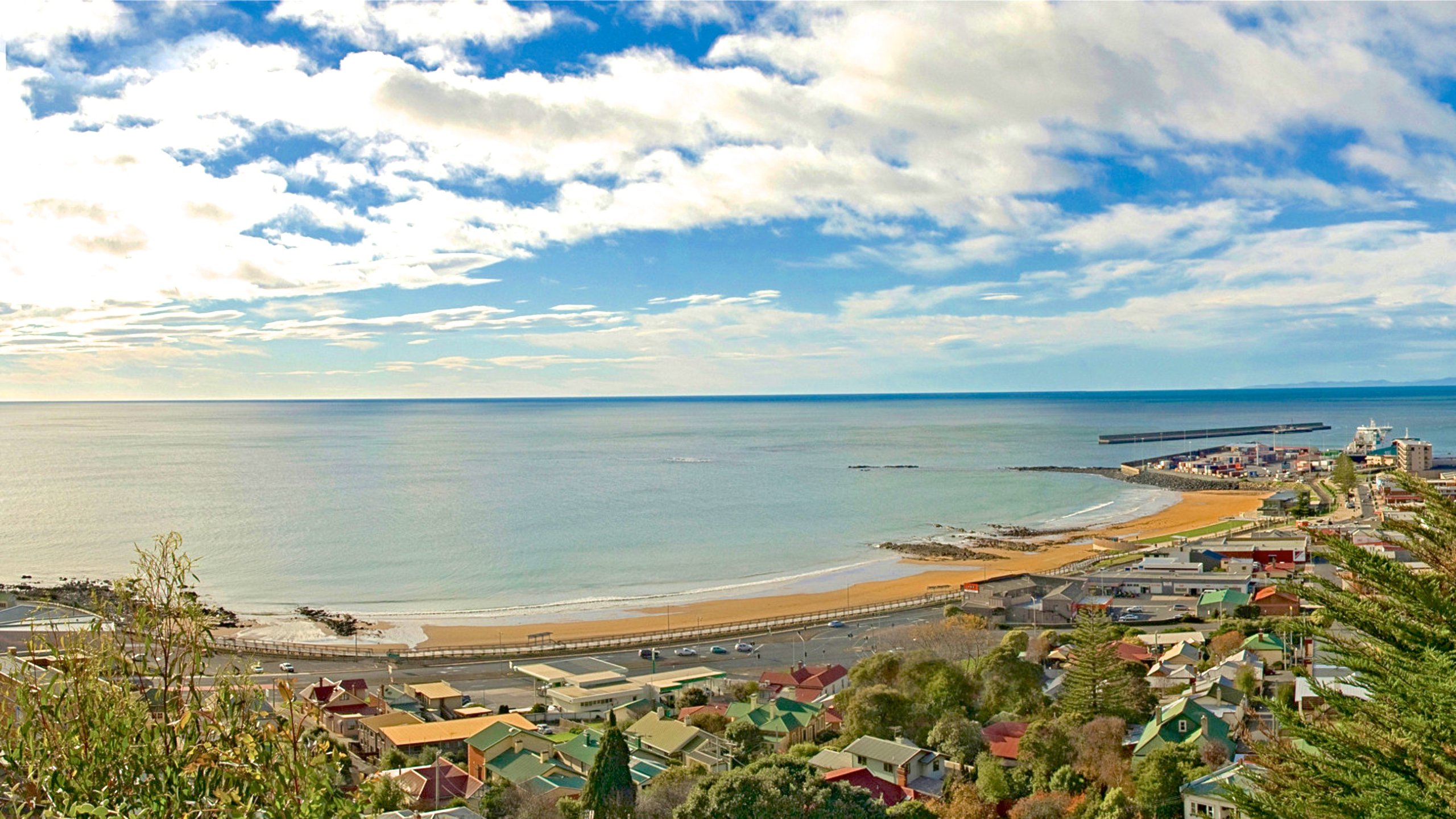 Burnie showing a beach and a coastal town