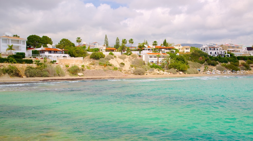 Coral Bay Beach which includes a bay or harbour, a coastal town and general coastal views