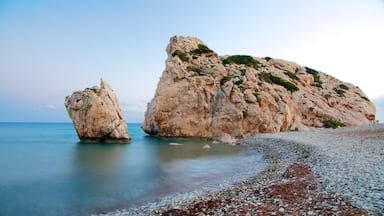 Aphrodite\'s Rock featuring a pebble beach