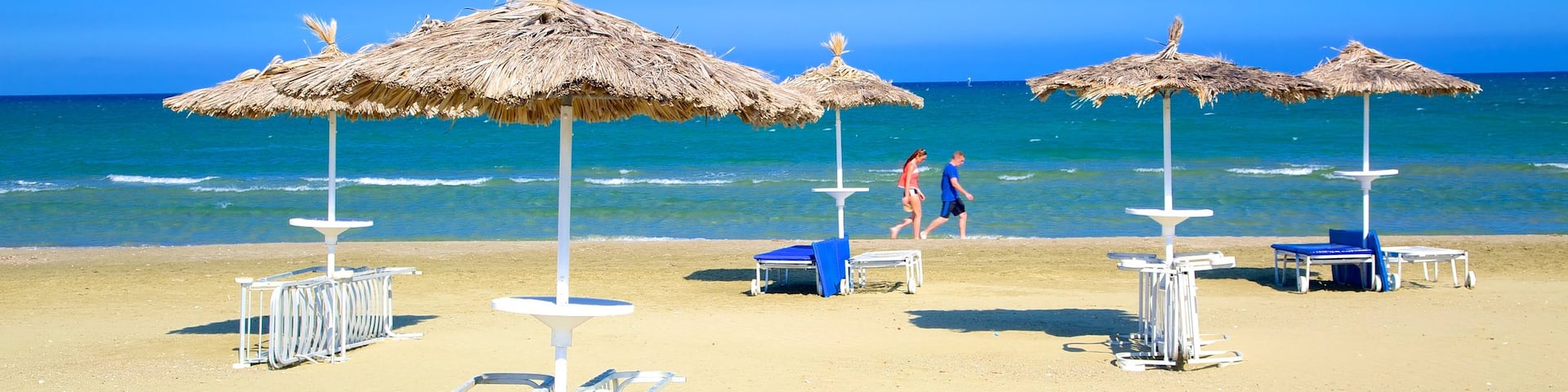 Larnaca which includes a bay or harbour, a sandy beach and general coastal views