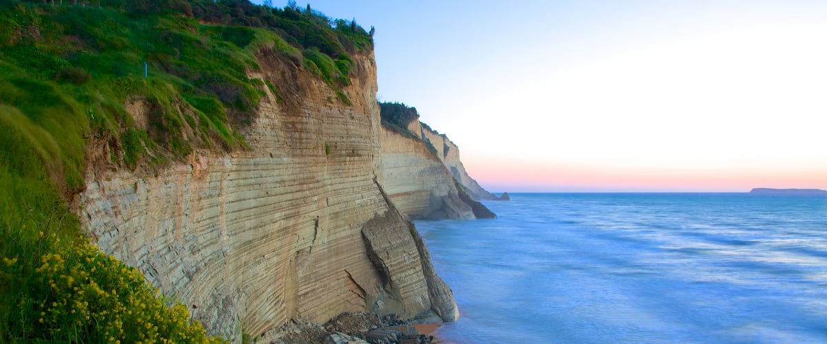 Sunset Beach showing rocky coastline and a sunset