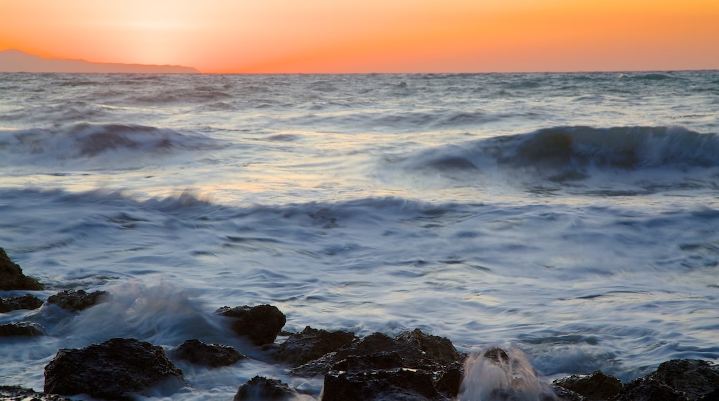 Sunset Beach which includes a sunset and general coastal views