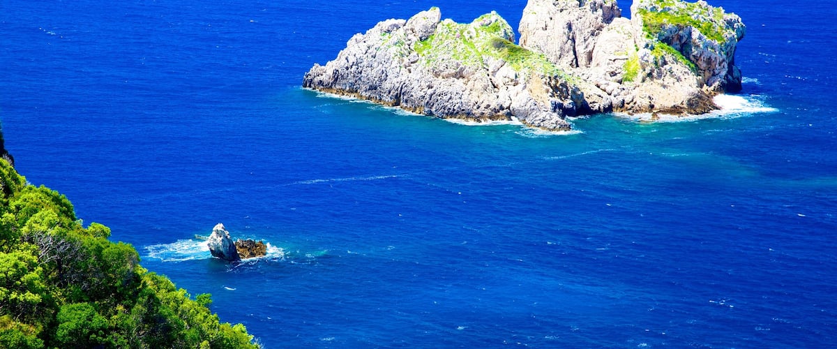 Paleokastritsa Beach featuring island views