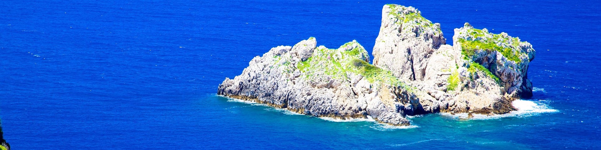 Paleokastritsa Beach featuring island views