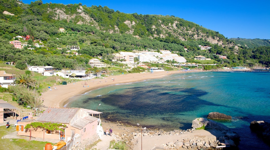 Pelekas Beach showing a coastal town, landscape views and a beach