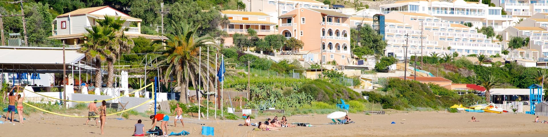Pelekas Beach which includes tropical scenes, landscape views and heritage architecture