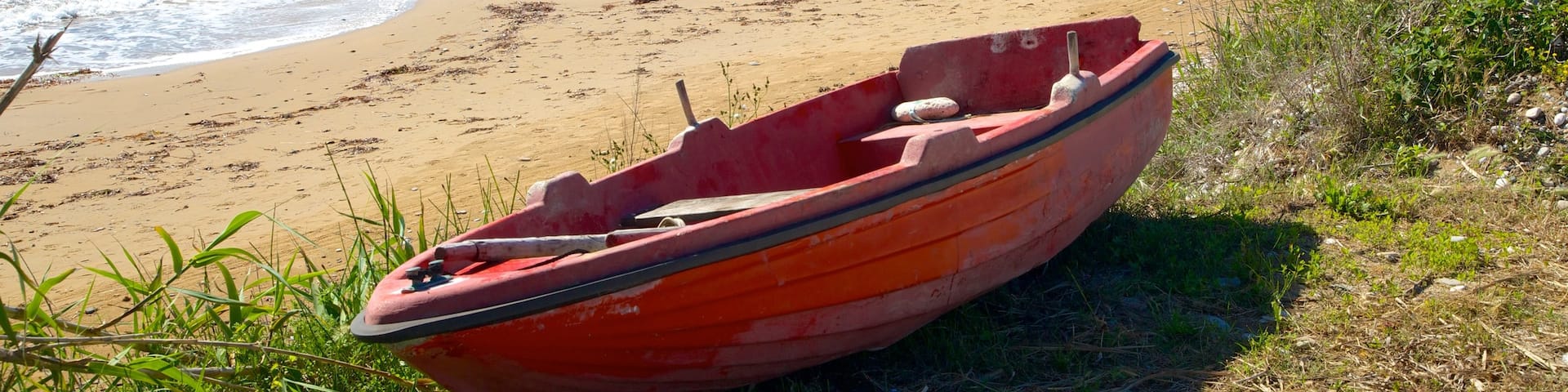 Arillas Beach featuring a sandy beach and landscape views