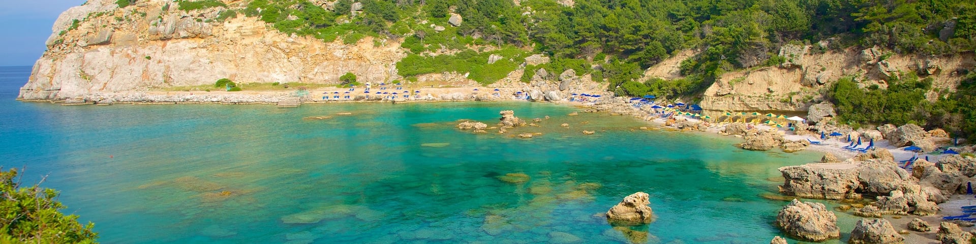 Anthony Quinn Bay which includes rugged coastline