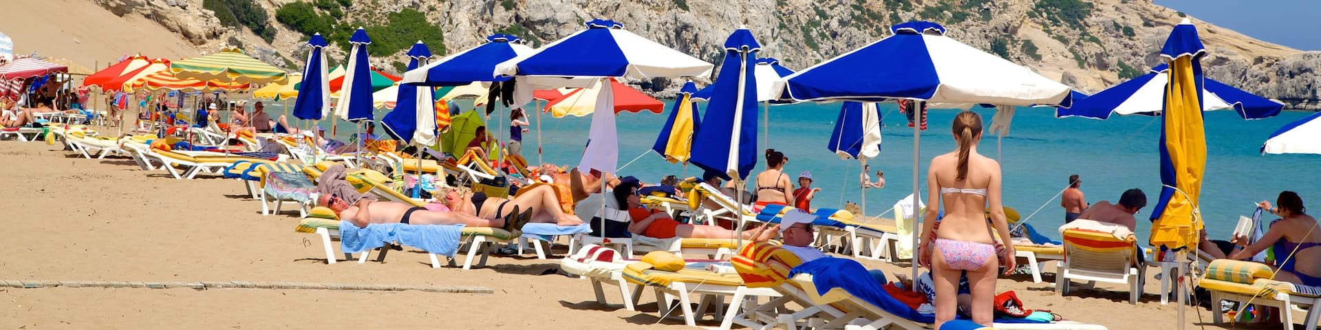 Tsambika Beach showing a sandy beach, swimming and landscape views