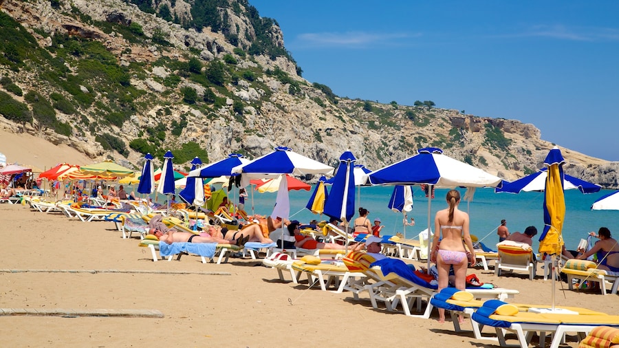 Tsambika Beach showing a sandy beach, swimming and landscape views