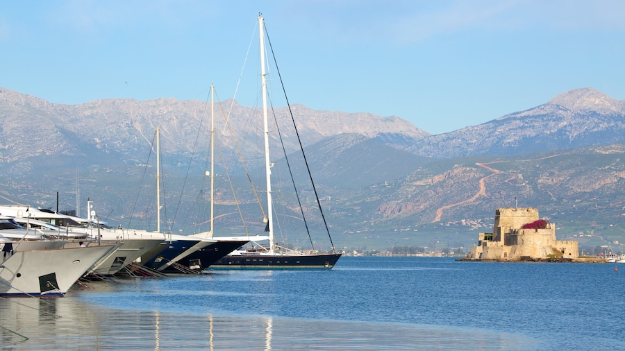 Castle of Bourtzi featuring a bay or harbor, sailing and mountains