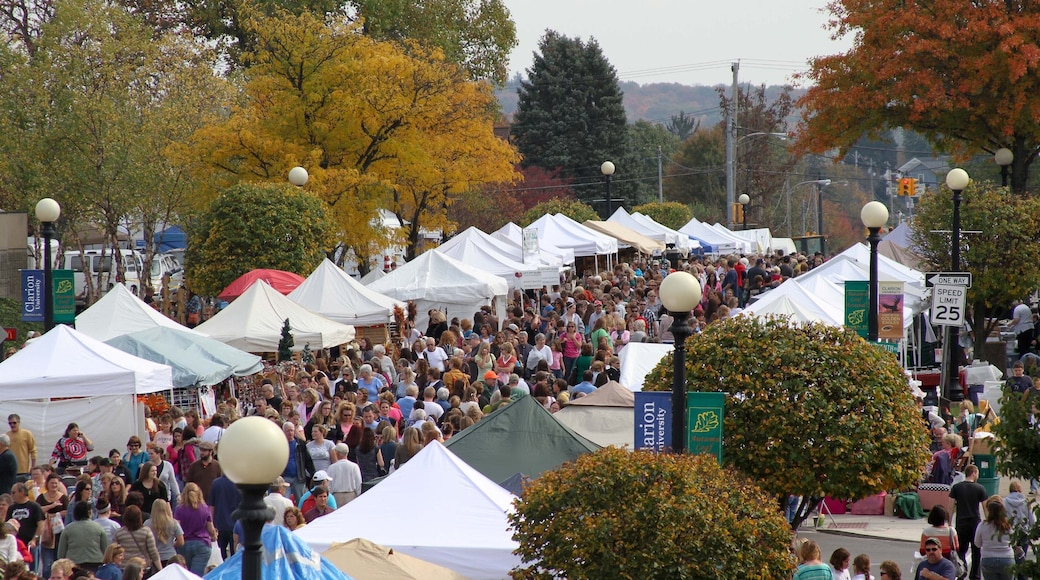 Clarion featuring markets as well as a large group of people