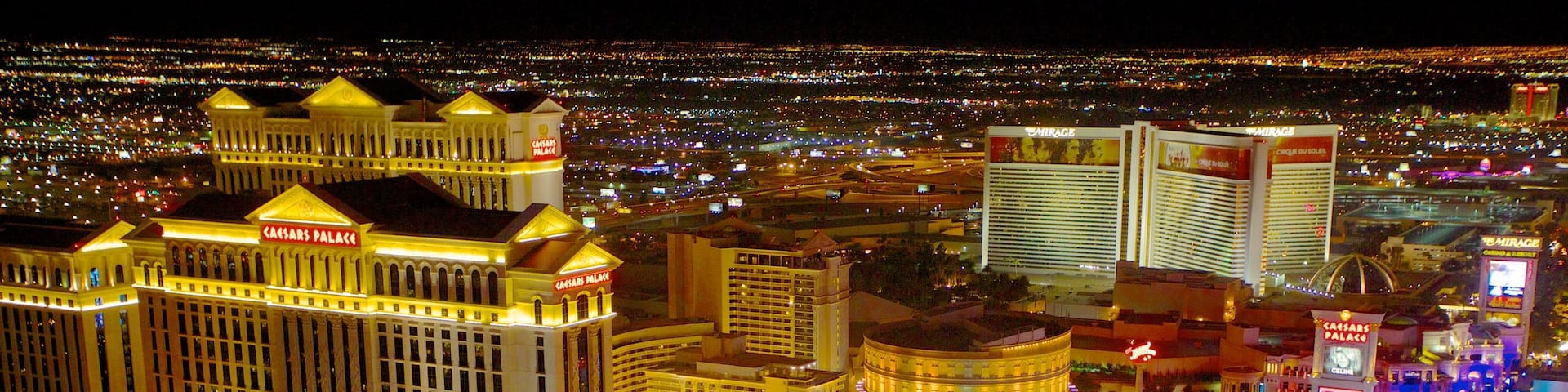 Nevada showing a city, night scenes and a skyscraper