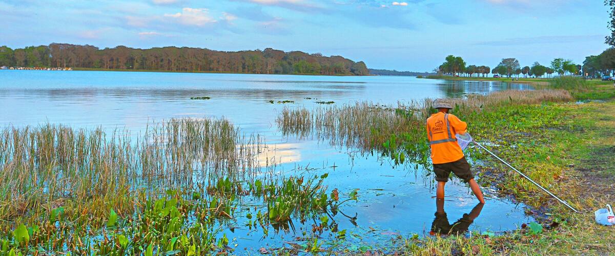 Leesburg featuring a lake or waterhole and fishing as well as an individual male