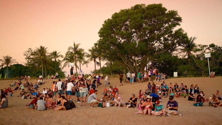 Mindil Beach showing a beach and a sunset as well as a large group of people